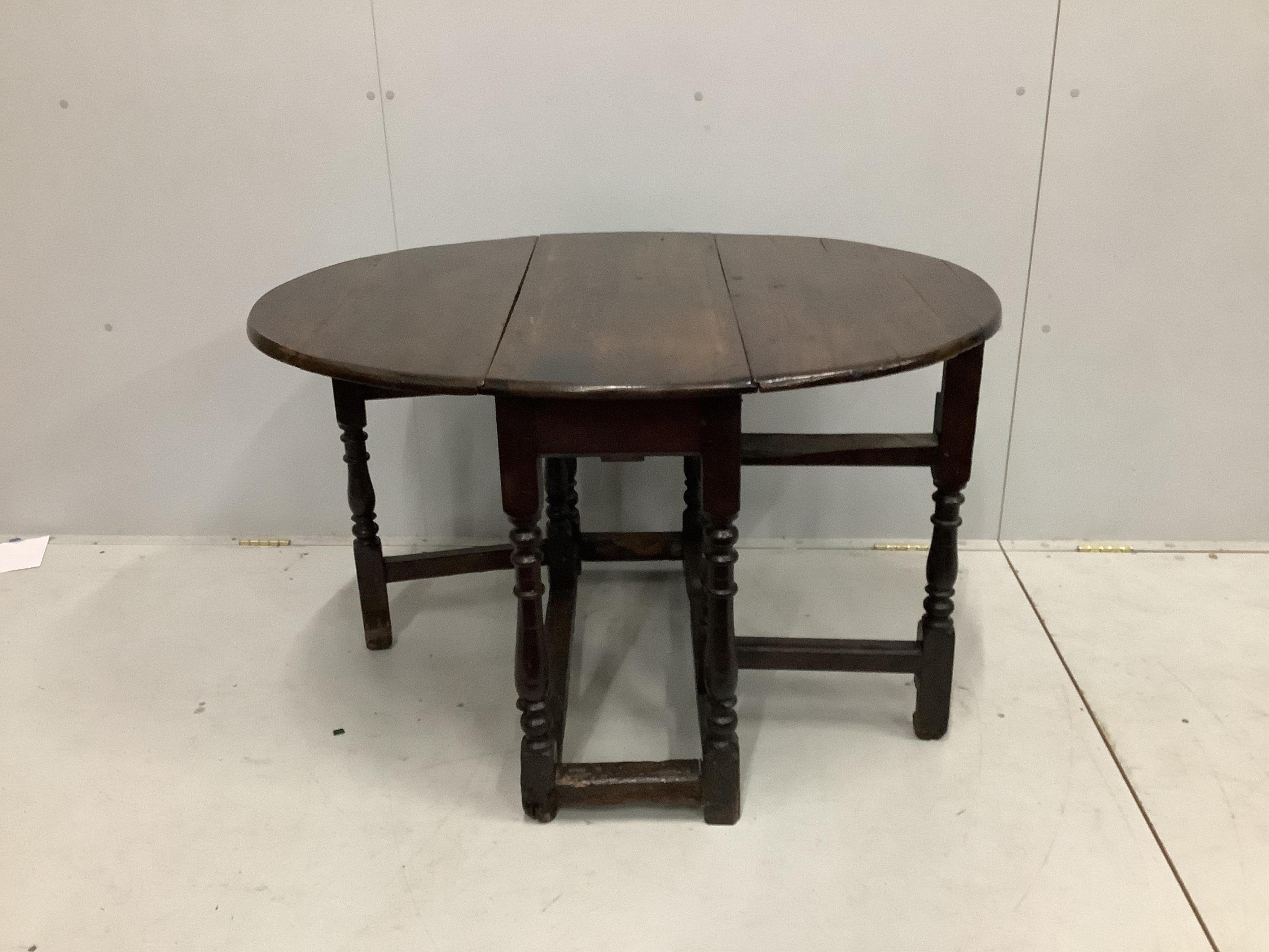 A small 17th century and later oak gateleg table, width 86cm, depth 31cm, height 68cm. Condition - fair